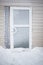 Aluminium glass door covered with snow