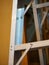 Aluminium ladder, dark wall, vertical