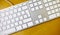 Aluminum blank keyboard on wooden desk