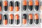 Aluminum blisters with colored black and orange oval capsules neat flat lay