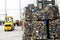 Aluminum briquettes at a garbage recycling plant in the background of a loader and shop workers