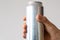 Aluminum can with carbonated drink in a male hand