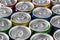 Aluminum cans with carbonated water, energy drinks or beer. Background of aluminum cans
