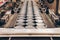 Aluminum cans for food processed in factory line conveyor machine at canned food manufacturing, selective focus and warm tone