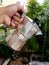 Aluminum coffee pot in man hand