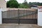 Aluminum dark gray metal double gates to house with portal grey to access home