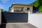 Aluminum dark gray metal gate to house with portal black to access home