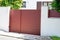 Aluminum dark red metal gate of suburb house door