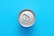 Aluminum drink or beverage can with pull ring on blue background