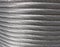 Aluminum electrical power cable background. Closeup image of heavy aluminum wire