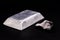 Aluminum ingot or bar next to aluminum ore, recycling or metal industry concept