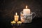 Aluminum mug as a candlestick with handmade decor of burlap and