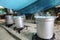 aluminum pots in an outdoor kitchen during the preparation of th