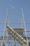 Aluminum Scaffolding & Ladder at a Construction Site against Blue Sky