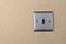 Aluminum switch plate on wall