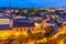 Alzette river bend with Saint Jean Du Grund cathedral and row of the houses behind, Luxembourg city, Luxembourg