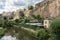 Alzette river Luxembourg city downtown Grund with fortifications and gardens