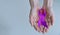 Alzheimer`s Disease AD Awareness with purple ribbon clipping path on human helping hand for World Alzheimers day month