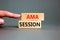 AMA ask me anything session symbol. Concept words AMA ask me anything session on wooden blocks on a beautiful grey background.
