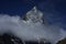 Ama Dablam in the clouds in Himalayas