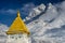 Ama Dablam peak at sunset, with the top of a stupa in the foreground