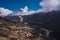 Ama Dablam summit or peak and Nepalese village in Himalayas