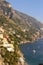 Amalfi Coast views of the ocean and homes built into the mountain cliffs in Positano, Italy