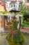 Amalfi, Italy - 1 November, 2019: The romantic old fountain of lovers, umbrella