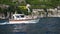 Amalfi, Italy - 3 September 2023. Cinematic view from tourist ferry of boat cruising along Amalfi coast. Looking at