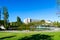 The Amalia Rodrigues Garden with a pond creating a specular reflection of an open air cafe