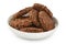 amaranth cookies with carob in ceramic bowl isolated on white background with full depth of field. Healthy food.