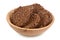 amaranth cookies with carob in wooden bowl isolated on white background with full depth of field. Healthy food.