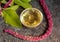 Amaranth oil with blooming Amaranthus caudatus plant