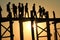 AMARAPURA, MYANMAR - NOVEMBER: Unidentified people walk on U Bein bridge at sunset on November, in Amarapura, Myanmar. U