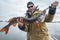 Amateur angler holds big pike fish