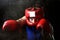 Amateur boxer man fighting with red boxing gloves and headgear protection