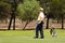 Amateur golfers playing a round of golf as a recreational pursuit