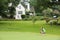 Amateur golfers playing a round of golf as a recreational pursuit