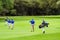 Amateur golfers playing a round of golf as a recreational pursuit