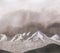 Amateur watercolor drawing of mountains covered with snow against an overcast sky