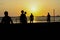 Amateurs playing football at Jumeira beach in Santa Marta, Colombia during sunset