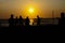 Amateurs playing football at Jumeira beach in Santa Marta, Colombia during sunset