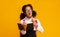 Amazed Afro Schoolgirl Doing Homework Holding Book And Pencil, Studio