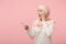 Amazed arabian muslim woman in hijab light clothes posing isolated on pink background. People religious Islam lifestyle