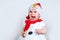Amazed attractive baby girl in Christmas costume having fun . Close-up portrait little girl in snowman costume