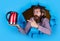 Amazed bearded brutal man with moustache pointing finger on kettle, household utensil