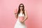Amazed bride woman in wedding dress, 3d glasses watching movie film, holding bucket of popcorn, plastic cup of soda or