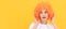 amazed fancy party look. freaky woman in clown wig on yellow background. express positive emotions. Woman isolated face