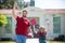 Amazed father walking son to school. Parent and pupil of primary school schoolboy with backpack. Portrait of cheerful