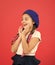 Amazed girl. Kid little cute fashion girl posing with long braids and hat red background. Child small girl happy smiling